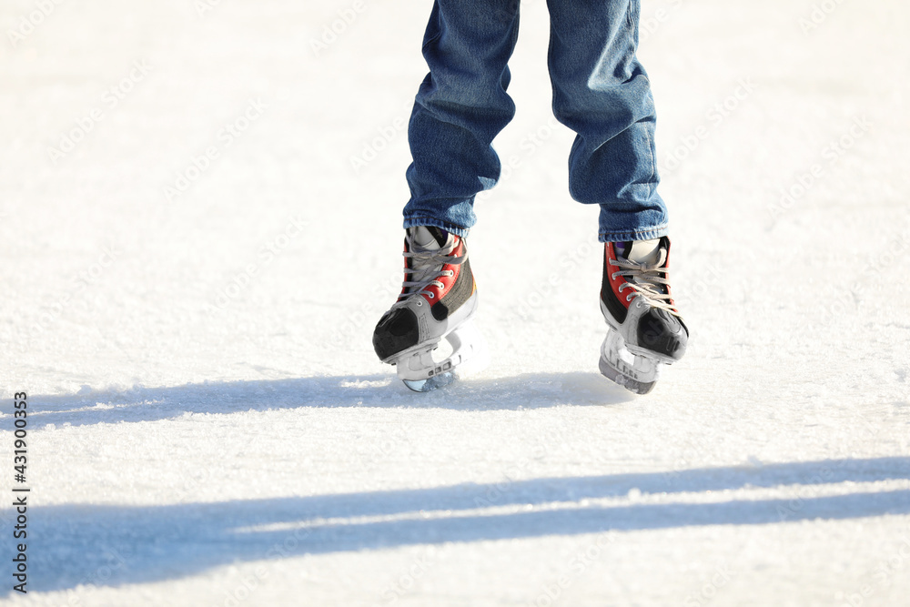Little child at outdoor ice skating rink, closeup Little child at outdoor ice skating rink, closeup