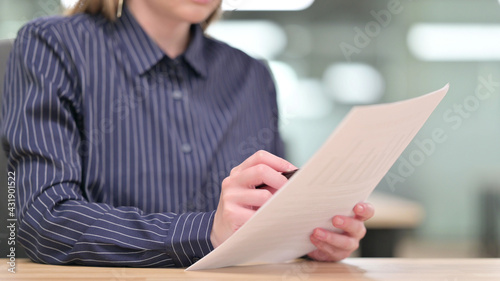 Close up of Businesswoman Reading Documents
