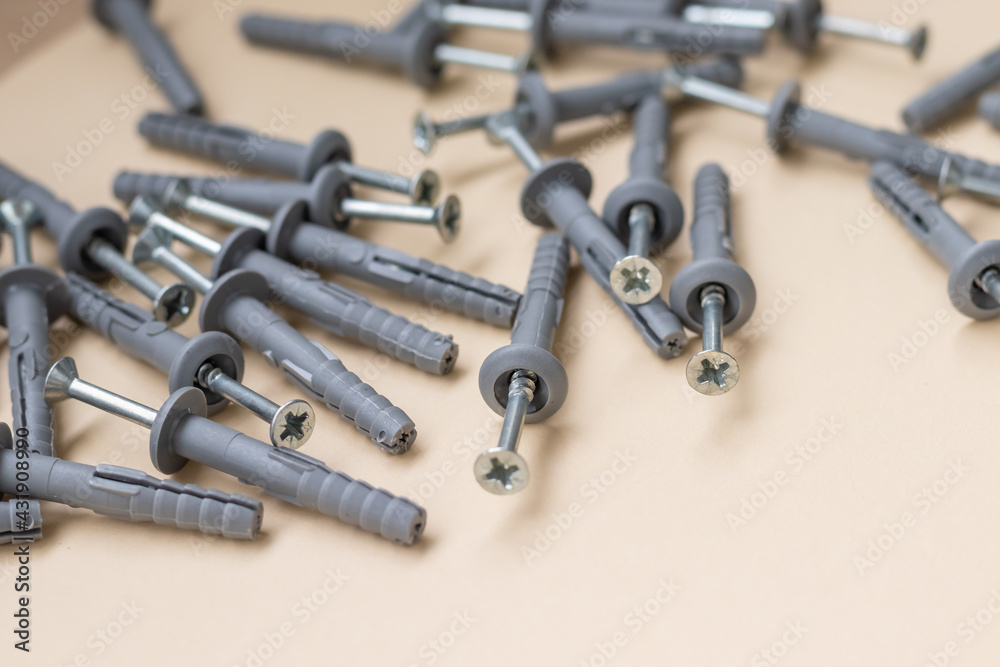 a group of dowels and nails on a yellow background a group of dowels and nails on a yellow background