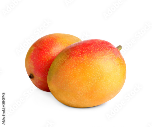 Delicious ripe juicy mangoes on white background