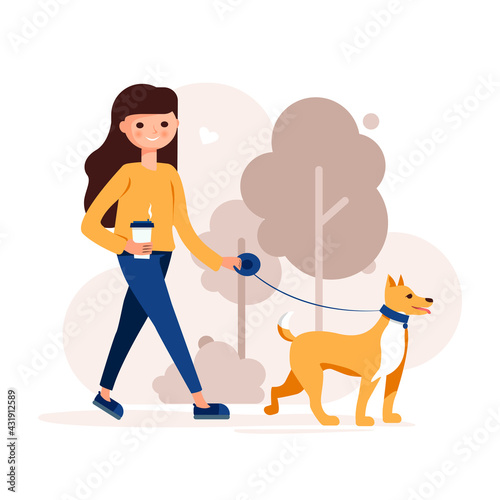 A girl with a dog walks in the park.