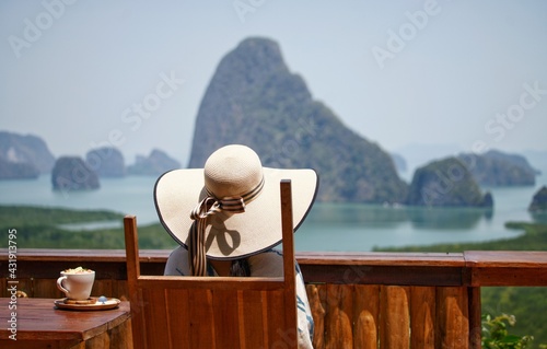 girl on the cafe with beach view