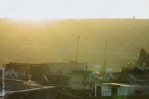 fog over the city during sunset