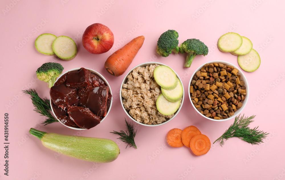 Pet food and natural ingredients on pink background, flat lay Pet food and natural ingredients on pink background, flat lay
