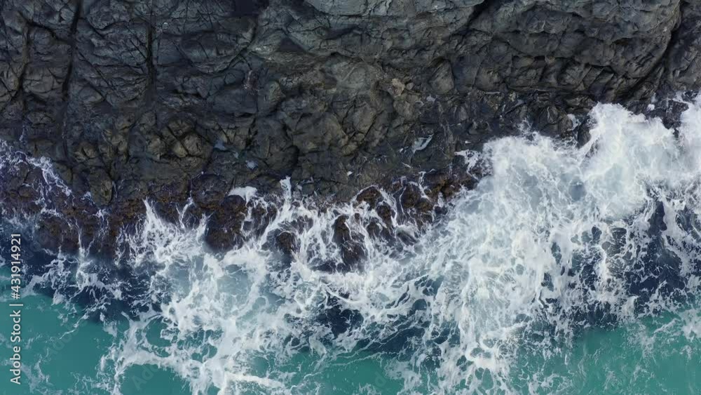 white waves wash black rock in sea, beautiful texture white waves wash black rock in sea, beautiful texture
