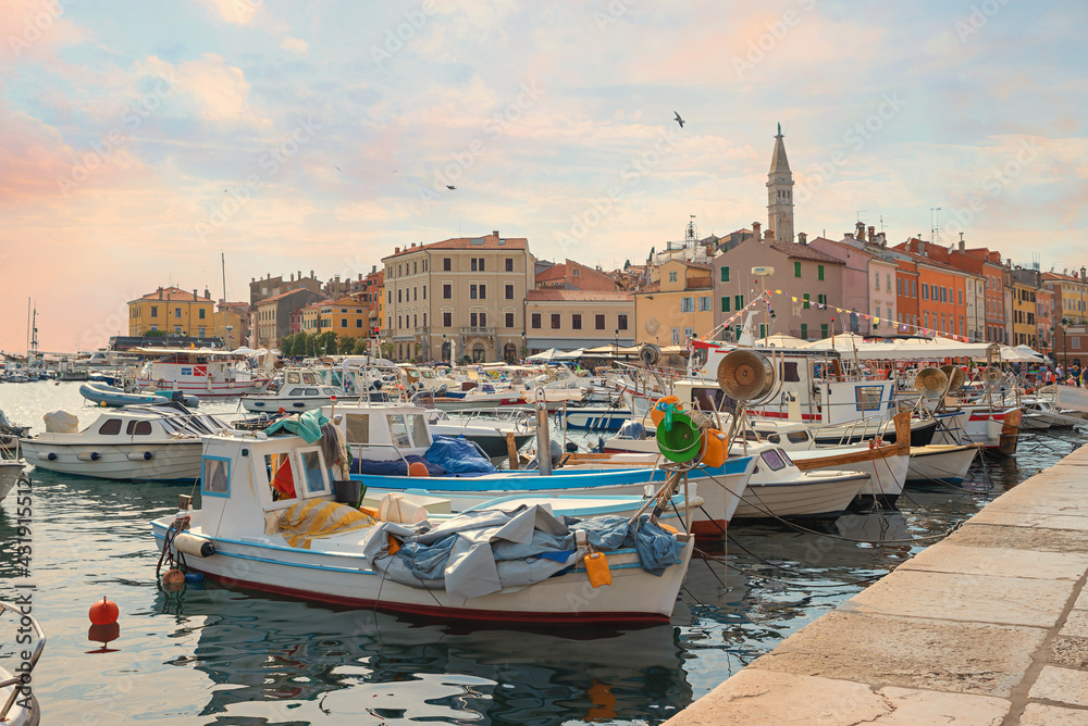 lovely harbor of tourist resort Rovinj, with colorful boats, morning scenery