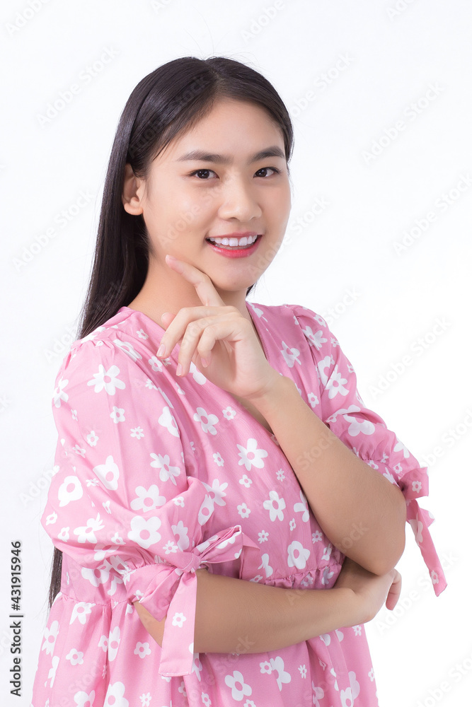 Portrait Asian beautiful girl in pink dress and black long hair. Her hands touch cheek, smile, show beautiful skin on white background. Portrait Asian beautiful girl in pink dress and black long hair. Her hands touch cheek, smile, show beautiful skin on white background.