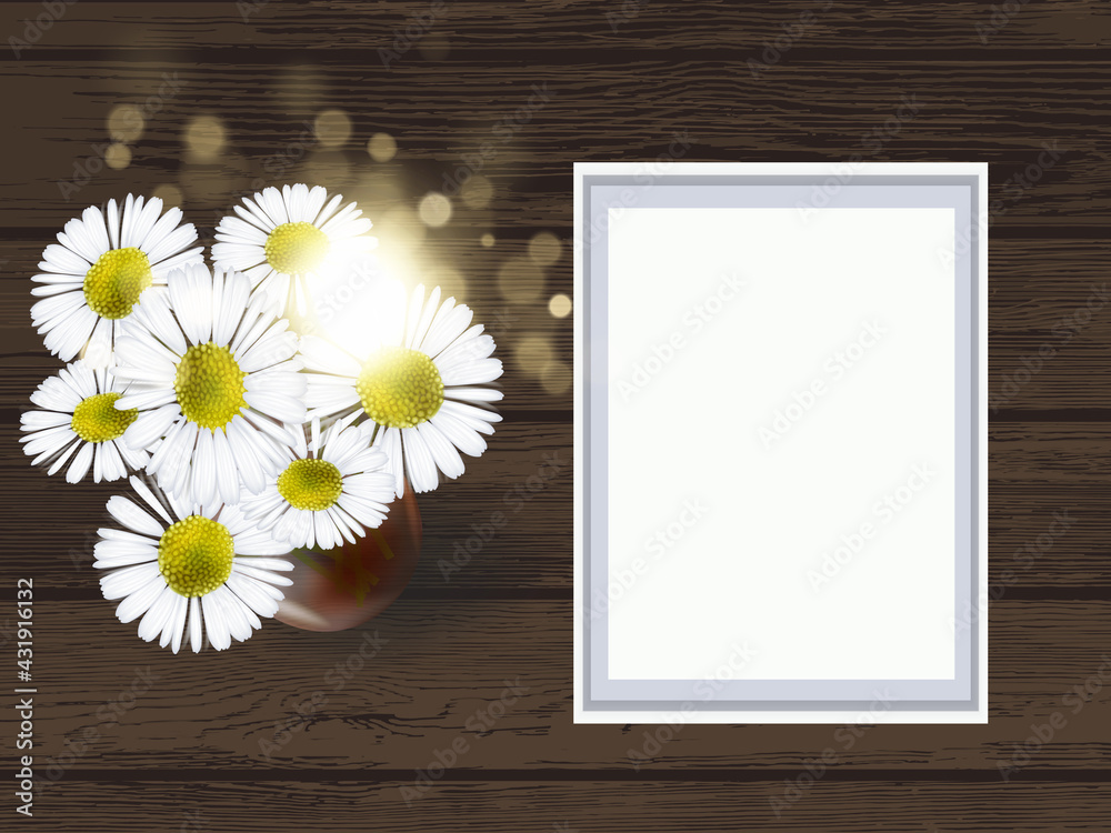 Obraz premium White small frame mockup with daisy wildflowers. Empty frame mock up for presentation artwork on wooden background. Template framing for modern art.