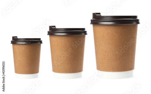 Set with different takeaway coffee cups on white background