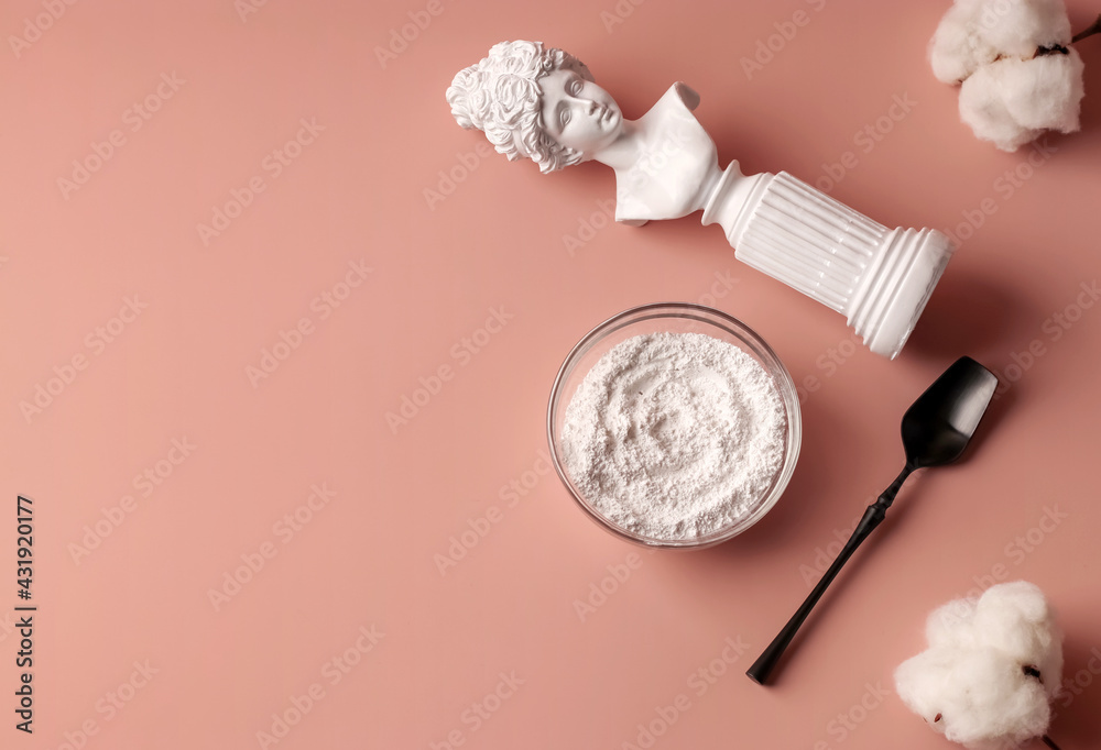 Hydrolyzed collagen in a glass cup and black spoon on a pink background. Health concept. Natural anti-aging supplement for beauty spa treatments. Copy space Hydrolyzed collagen in a glass cup and black spoon on a pink background. Health concept. Natural anti-aging supplement for beauty spa treatments. Copy space