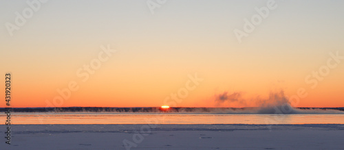 Winter sunrise steam fog