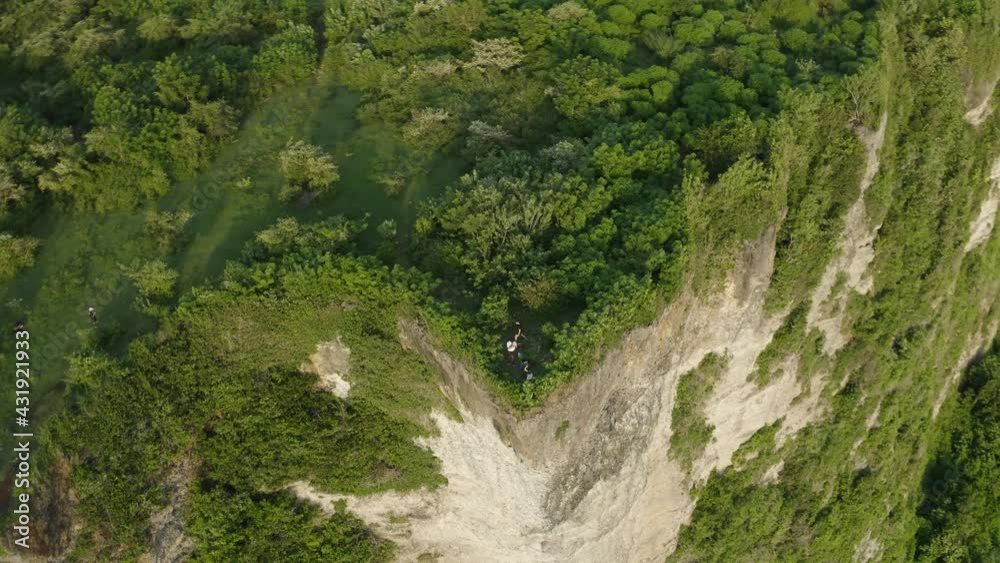 Drone Shot Orbiting Group of People Socialising Near a Cliff Edge Drone Shot Orbiting Group of People Socialising Near a Cliff Edge