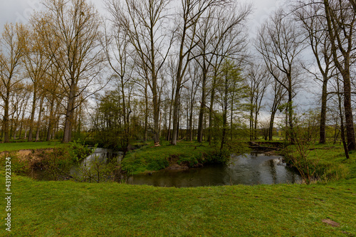 A dramatic sky during spring over the dutch rolling hills in the south of Limburg close to Maastricht. photo