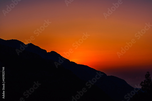 bright sunset in the mountains on a summer evening © Alx_Yago