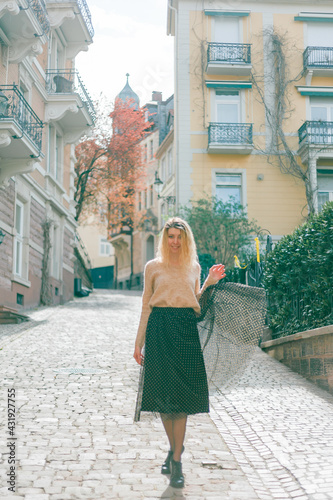 Beautiful young woman on the street of a European city. Travels. Happiness. Spring. © Kristina89