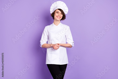 Fényképezés Portrait of attractive cheerful girl skilled experienced chef cafe employee isol