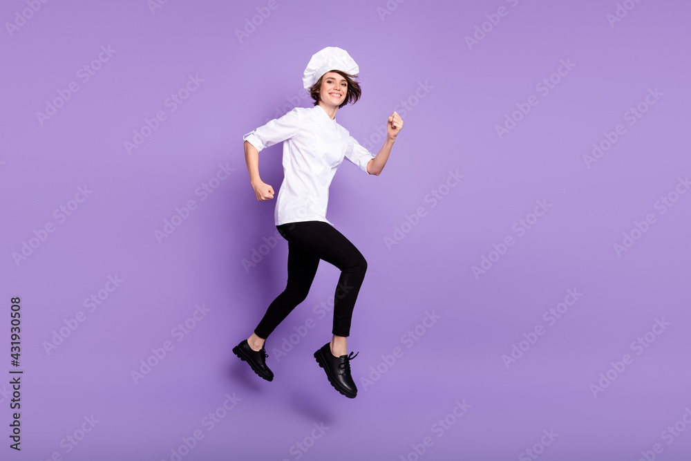 Full length body size view of attractive content cheerful chef jumping running isolated over bright violet purple color background