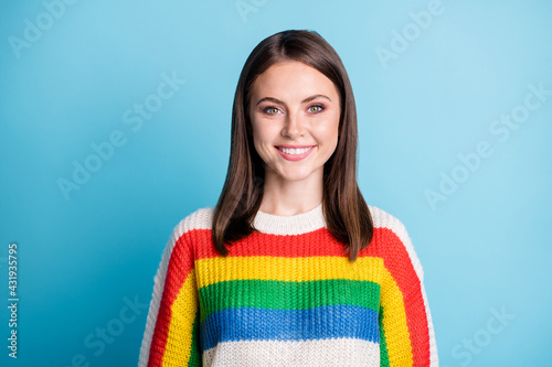 Photo of sweet shiny young lady wear striped outfit smiling isolated blue color background