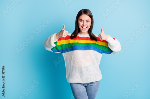 Photo of cute charming young lady wear striped outfit showing two hands arms thumbs up isolated blue color background