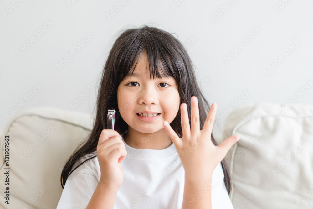 clean nails.kid child girl cutting nails using stainless steel nail clipper at home.Hygiene.virus bacteria in nails.Toe nail cutting with a cutter.sanitizer hand.coronavirus covid19.skin care. clean nails.kid child girl cutting nails using stainless steel nail clipper at home.Hygiene.virus bacteria in nails.Toe nail cutting with a cutter.sanitizer hand.coronavirus covid19.skin care.