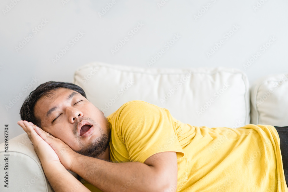 Asian man take a nap on sofa with snore.take nap daydreaming in living rooms snoring.Healthcare medical.Sleep health.man sleep at home.Dream, rest, tired father dad day.Sleep Apnea.Sdb.resting at home Asian man take a nap on sofa with snore.take nap daydreaming in living rooms snoring.Healthcare medical.Sleep health.man sleep at home.Dream, rest, tired father dad day.Sleep Apnea.Sdb.resting at home