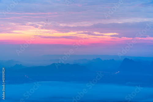 Sunrise at mountain cliff with mountain background. Nature park and outdoor landscape background