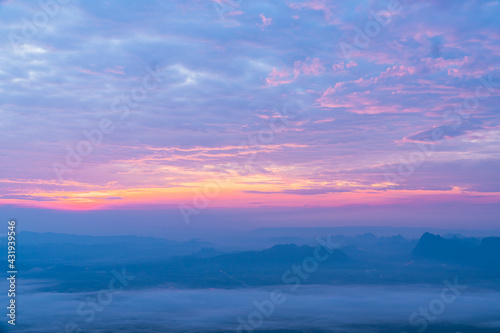 Sunrise at mountain cliff with mountain background. Nature park and outdoor landscape background