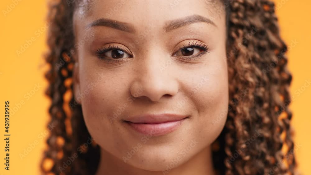 Close up portrait of glad pleased cheerful young african american woman smiling to camera, feeling happy and satisfied Close up portrait of glad pleased cheerful young african american woman smiling to camera, feeling happy and satisfied