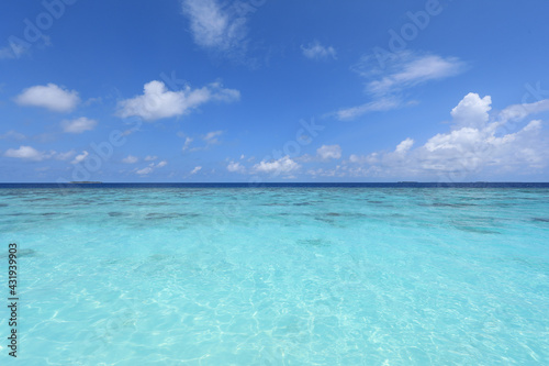 paradise idyllic seascape in the Indian Ocean, turquoise water and blue sky