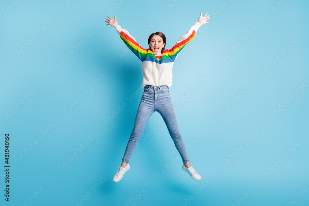 Full length body size view of pretty fit girlish cheerful girl jumping like star having fun isolated over bright blue color background