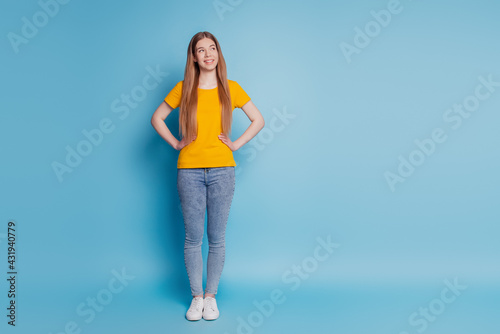 Portrait of thoughtful lady look empty space think on blue background