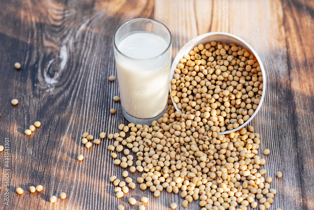 Delicious soy milk on wooden table background with Sunlight in the morning. Fresh healthy drink concept. Delicious soy milk on wooden table background with Sunlight in the morning. Fresh healthy drink concept.