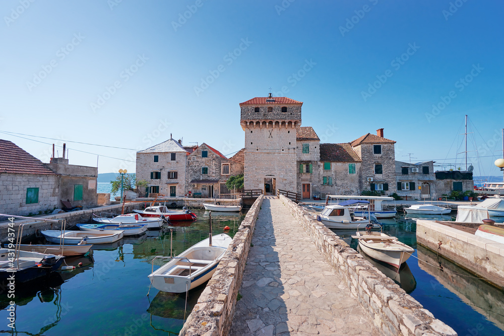 Kastel Gomilica Castle, coast in Dalmatia, Croatia. A famous tourist destination on the Adriatic sea. Ancient architecture and tourism.