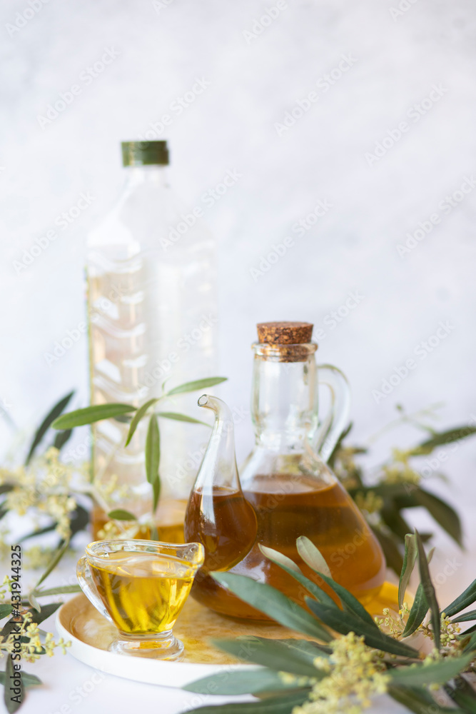 Olive branch and olive oil bottle isolated on white. Olive branch and olive oil bottle isolated on white.