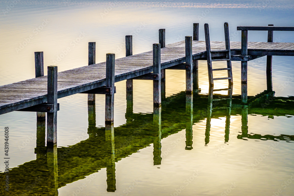 old wooden jetty at a lake in bavaria