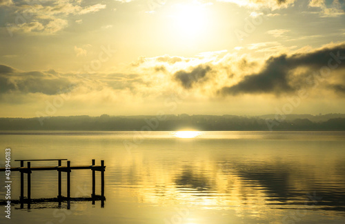 old wooden jetty at a lake in bavaria