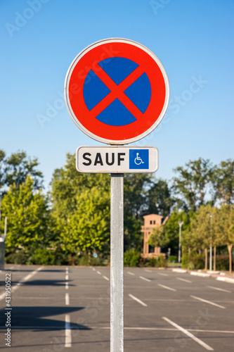 French road sign indicating a space reserved "only" for disabled people