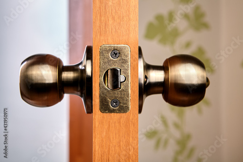 Door handles with latch, ball-shaped, bronze color. photo