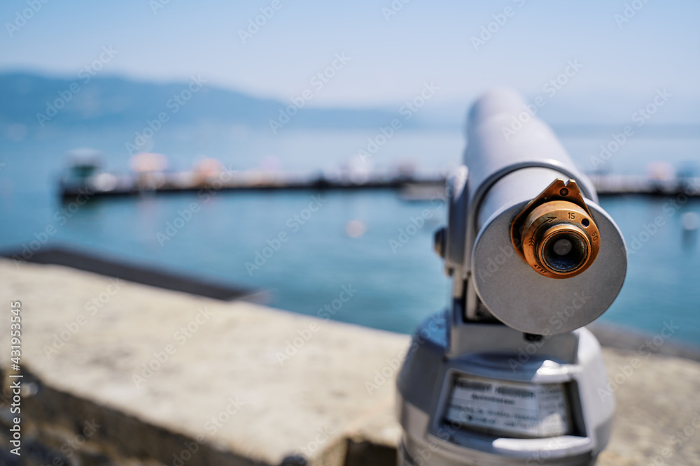 Coin Operated Spyglass viewer next to the waterside promenade looking out to the bay. Coin Operated Spyglass viewer next to the waterside promenade looking out to the bay.