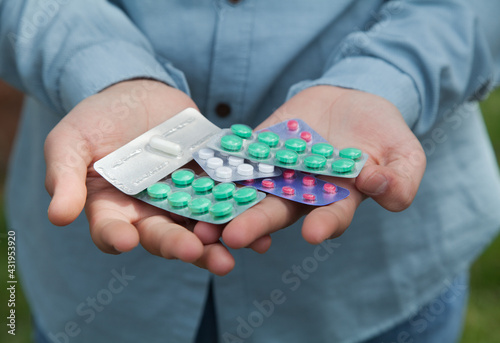 Man holding pills. Concept of medicine.