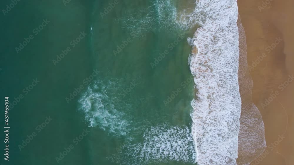Professional Video. Aerial view Nature video. Powerful stormy sea waves in top-down drone shot perspective. Crashing wave line in Phuket South of Thailand. Andaman sea with foamy white texture. Professional Video. Aerial view Nature video. Powerful stormy sea waves in top-down drone shot perspective. Crashing wave line in Phuket South of Thailand. Andaman sea with foamy white texture.