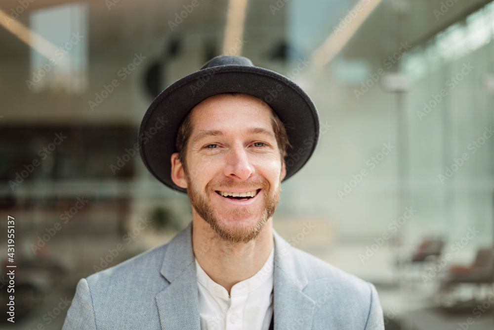 Smiling businessman wearing hat Smiling businessman wearing hat