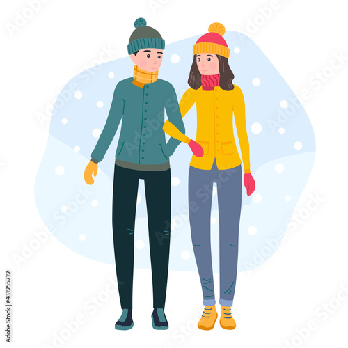 Young couple walking holding hands. Man and woman wearing winter clothes, spend time together