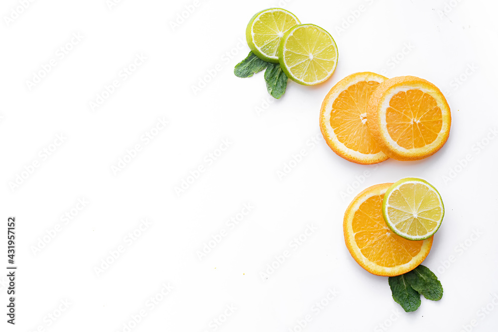 Citrus fruits on a white background are cut . Colored fruits. The citrus family. citrus sliced layout top view on a white background. An article about healthy eating. Keto diet. Citrus fruits on a white background are cut . Colored fruits. The citrus family. citrus sliced layout top view on a white background. An article about healthy eating. Keto diet.