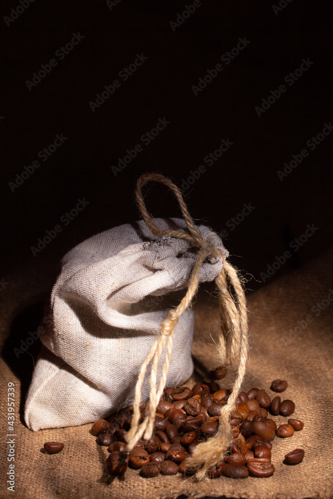 Small pouch made of natural linen with roasted coffee beans