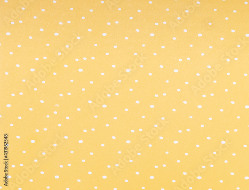 yellow background with white dots