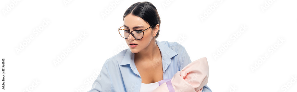 young woman in eyeglasses holding infant baby isolated on white, banner.
