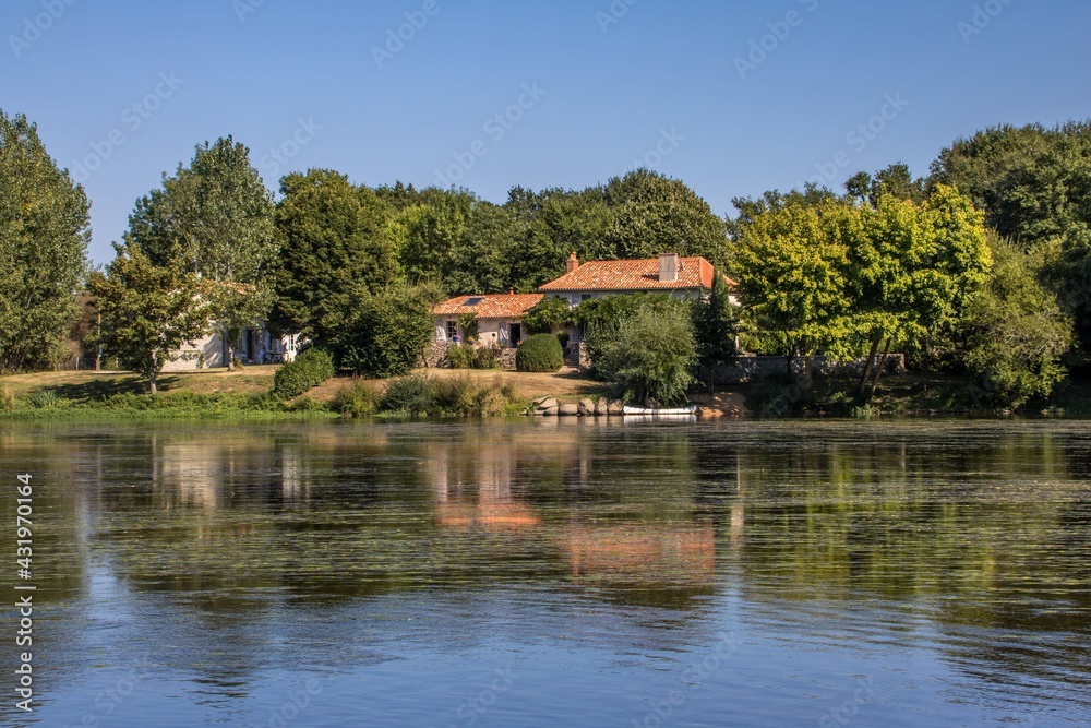 reflections in a river in rural France