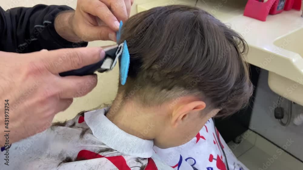 Little boy getting a haircut. 4K Little boy getting a haircut. 4K