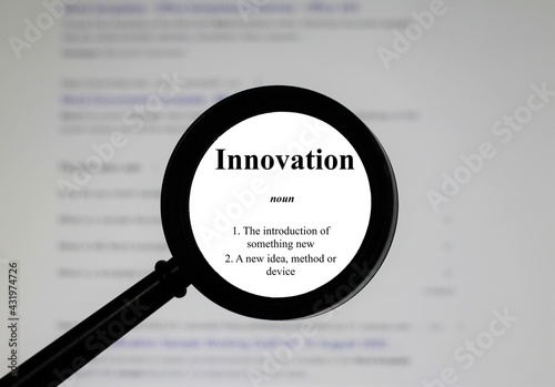 Selective focus on word innovation, word in a dictionary. Close up of an English dictionary page with the word innovation